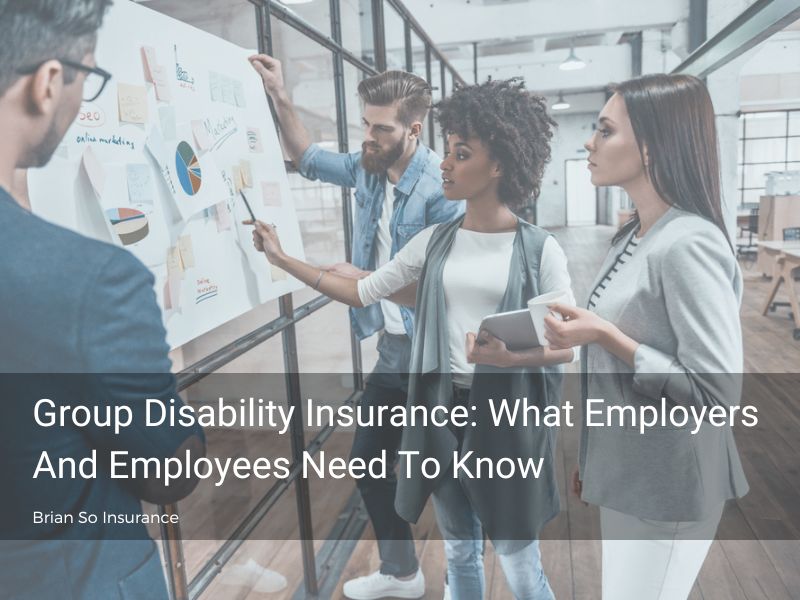 group-disability-insurance-colleagues-standing-in-front-of-charts