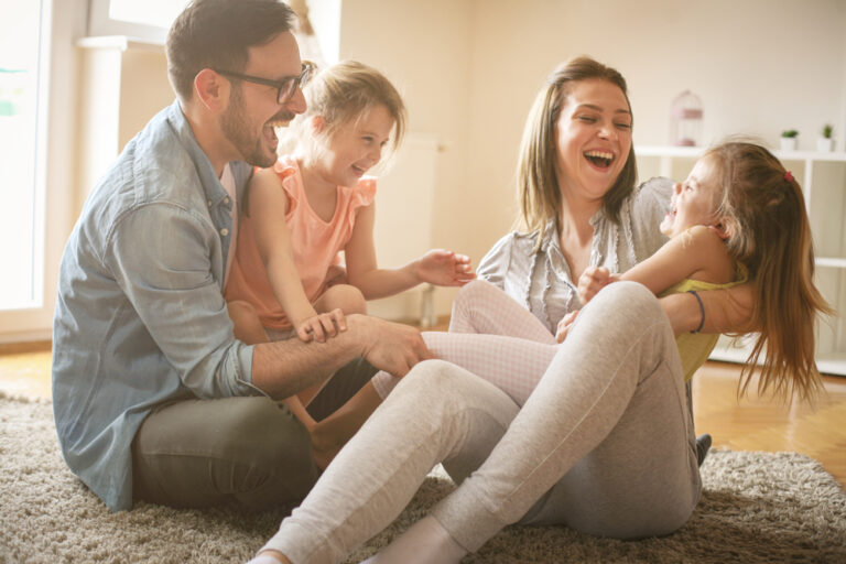 happy-family-of-four-playing-term-life-insurance