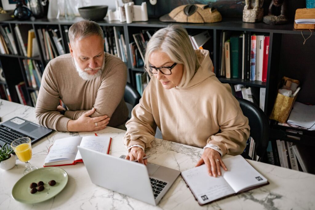 Older couple reviewing financial documents at home